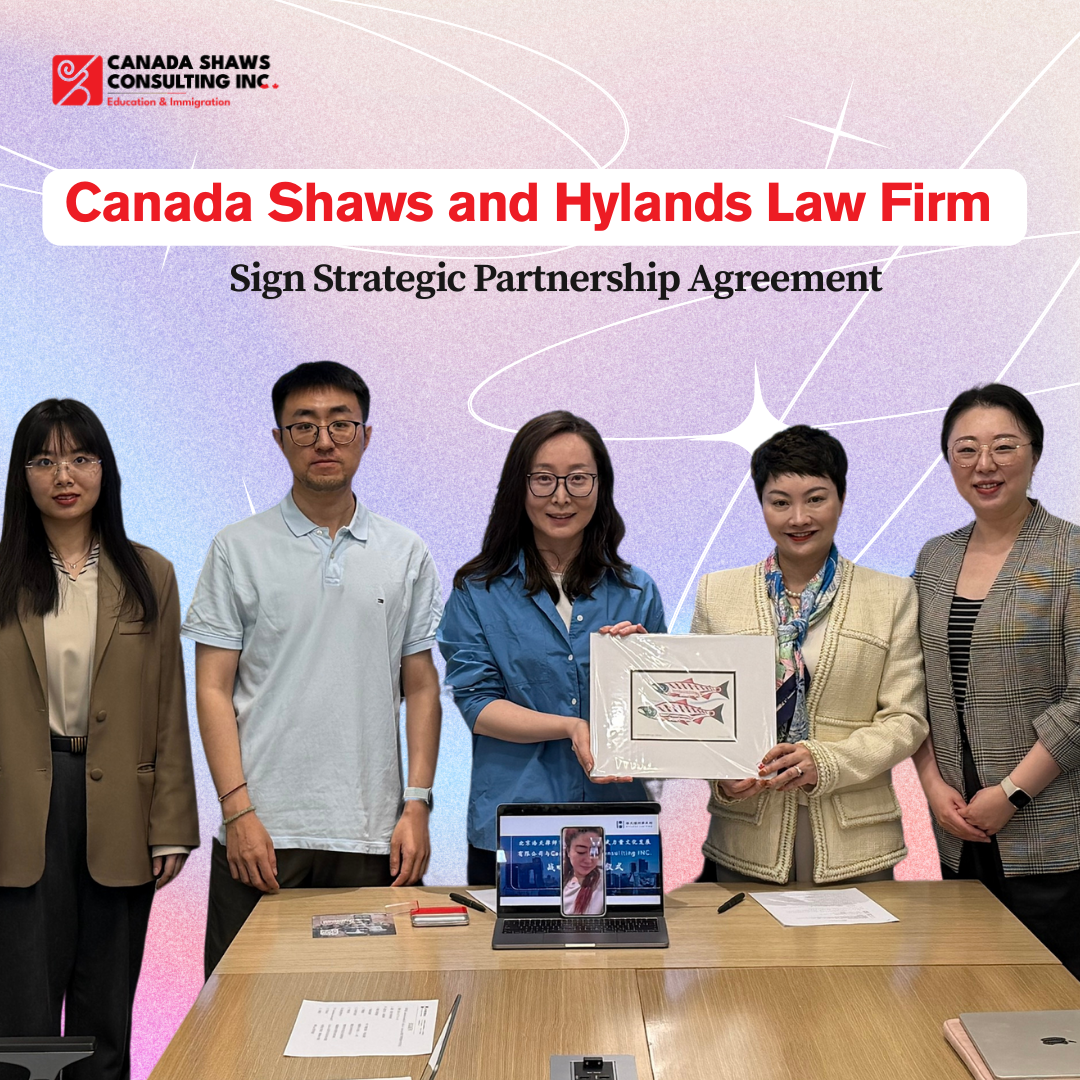 A group of five team members from Canada Shaws and Hylands Law Firm are gathered in a conference room, posing in front of a large display screen showing the title of the strategic partnership signing ceremony. Two women in the center hold a framed certificate representing the agreement, with one additional participant joining via video call on a laptop placed on the table.