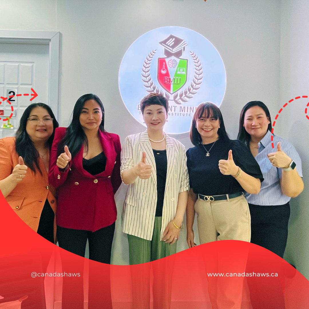 “Canada Shaws President Cellia Xiao and four women from Brilliant Minds Training Institute pose in front of the institute’s logo. All five are smiling and showing thumbs-up gestures.”