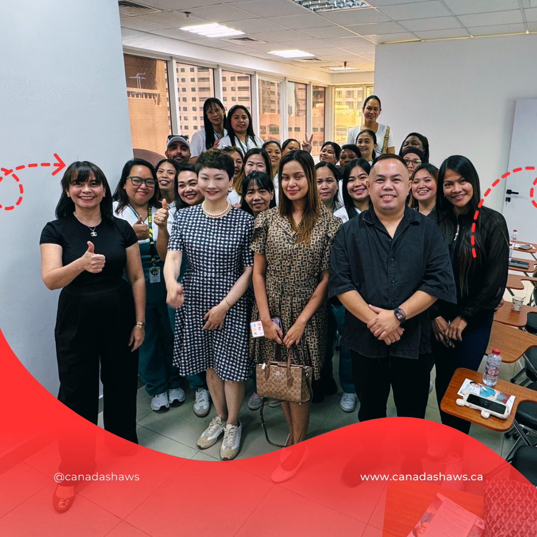 “Group photo with Canada Shaws and Brilliant Minds Training Institute team and students. Over 20 people, including Cellia Xiao and multiple female trainees, pose in a classroom setting, many holding thumbs-up.”