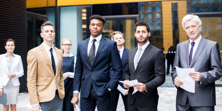 gentlemen and ladies in a picture standing confidently leveraging benefits of canadian startup visa