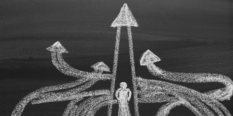 person facing multiple arrows, symbolizing different canada immigration pathways
