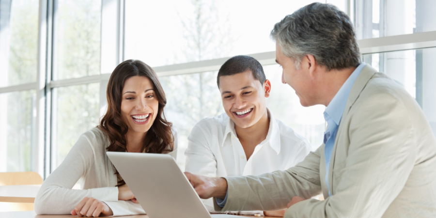 happy couple discussing immigration options with consultant after study permit refusal in canada