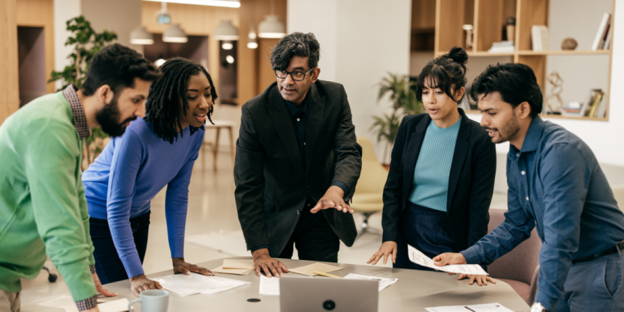 diverse team reviewing opportunities and discussing jobs in canada for immigrants