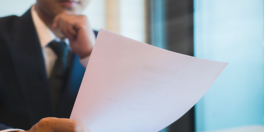 man reviewing documents carefully to prepare for canada pr