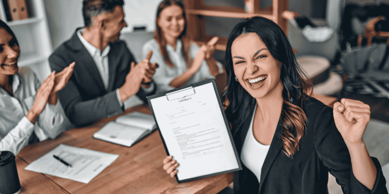 woman celebrating contract offer for post-graduation work permit approval