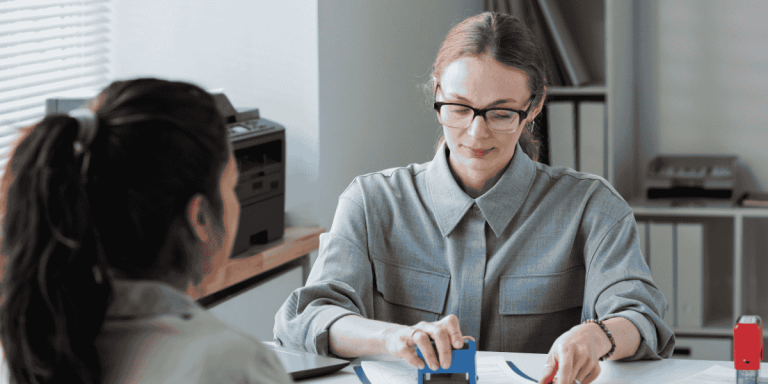 eb-5 regional center's officer stamping documents during visa process