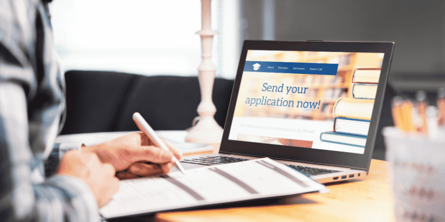 scholarships for undergraduate students​ applying online with laptop and forms