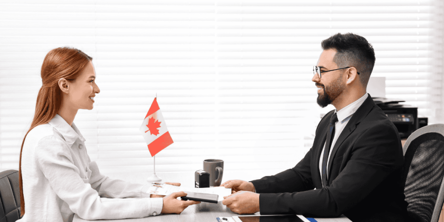 woman at immigration office discussing lmia delays in canada