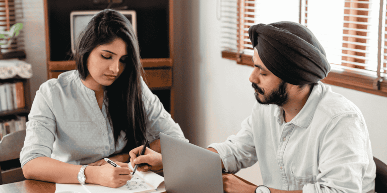 couple filling documents to apply and work on spouse visa